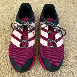Pink and black adidas running shoes.